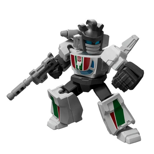 Tranformers Wheeljack toy robot figure with a white and gray color scheme that has red and green accents