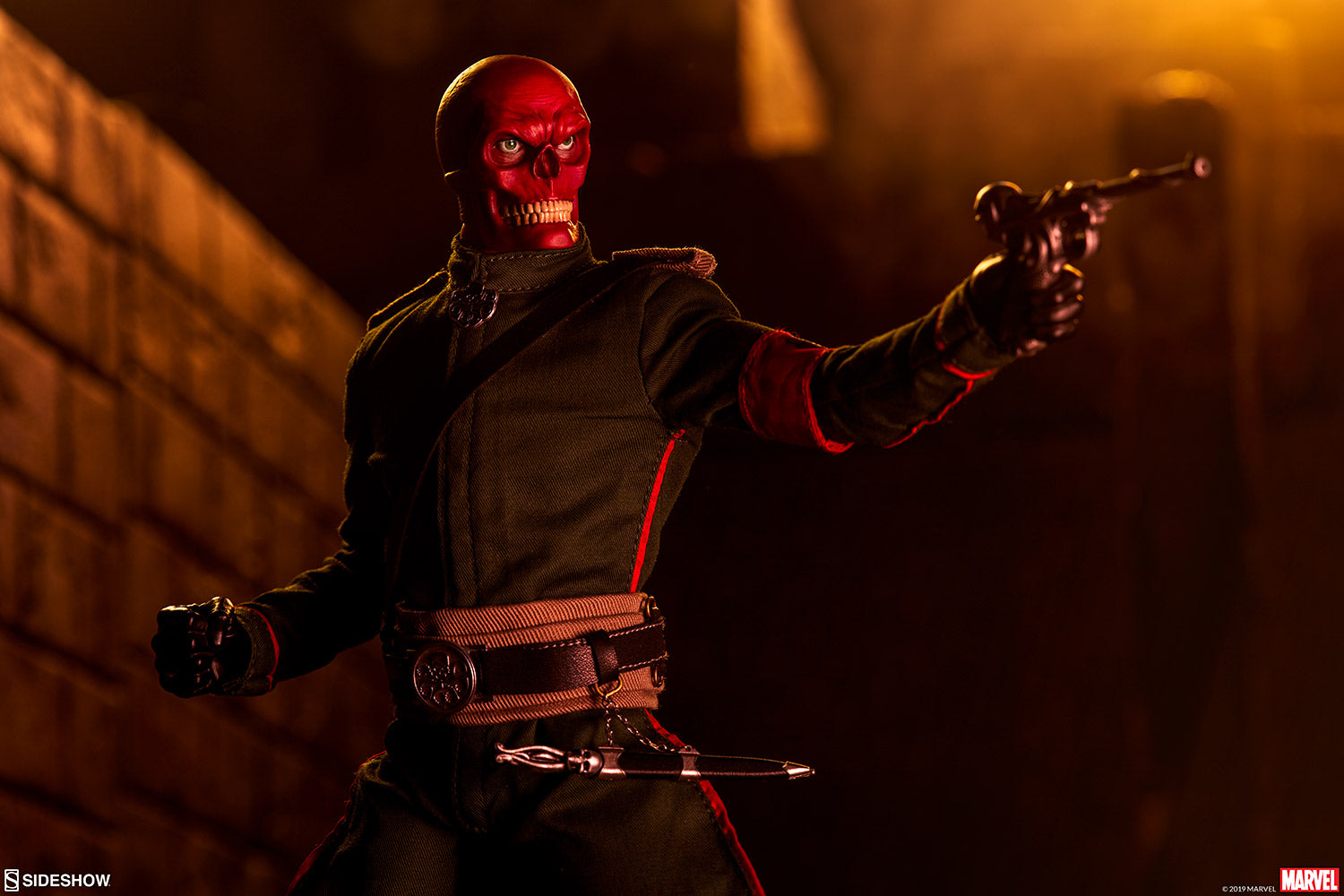 Sideshow exclusive Marvel Red Skull Sixth Scale Figure posing with gun